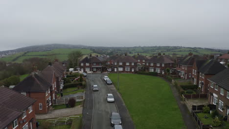 Aerial-view,-footage-of-a-council-housing-estate-in-Kidsgrove-Stoke-on-Trent,-flats,-homes-for-the-ever-growing-population,-immigration-and-poorer-areas-of-the-west-midlands,-cheap,-affordable-housing