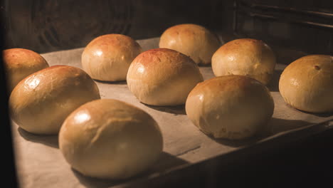 Motion-Timelapse-Of-Delicious-Glazed-Buns-Baking-In-A-Pre-heated-Bakery-Oven---close-up