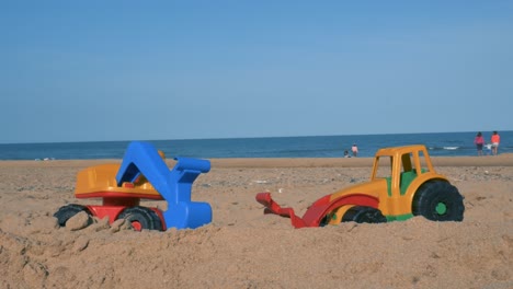 Toy-Trucks-Left-On-The-Beach-In-Ireland---close-up