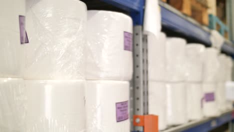 Packages-of-paper-towels-on-shelf,-warehouse-supply-close-up