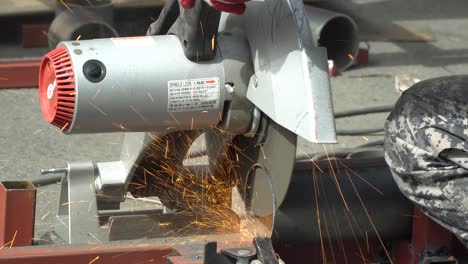 Craftsman-Cutting-A-Metal-Galvanized-Iron-Pipe-With-Cut-off-Machine---super-close-up-macro