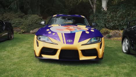 Custom-Wrapped-Toyota-Supra-Parked-On-Grass-at-a-Luxury-Car-Show