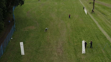 Aerial-Shot-Of-A-Competitor-Downhill-Grass-Skiing-At-A-Ski-Competition-in-Europe