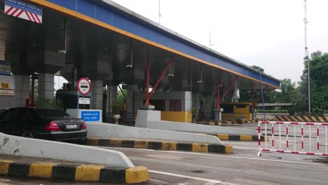 Cars-passing-through-Cipularang-toll-gate-in-West-Java,-government-tax-system