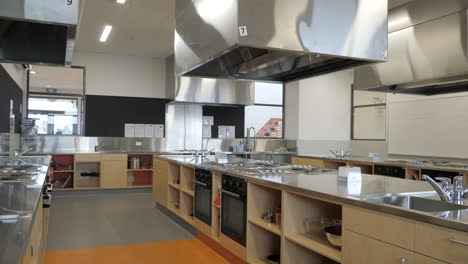 Empty-Modern-High-School-Kitchen-Classroom,-PAN-RIGHT