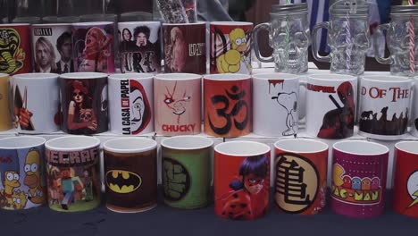 Slow-pan-right-shot-of-new-coffee-mugs-for-sale-at-street-market