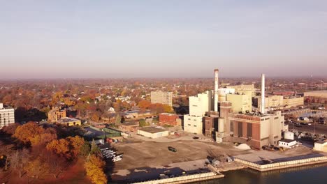 Aerial-View-Of-Power-Plant-Near-The-City-During-Daytime-Of-Autumn-In-Wyandotte-Michigan,-USA---Aerial-Drone-Shot