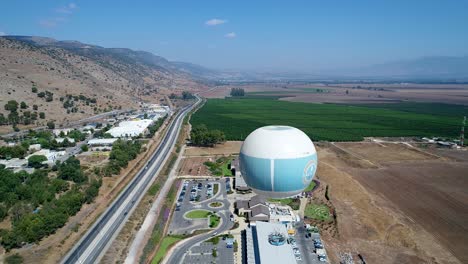 Hot-Air-Balloon-flying-over-Glilion-Hotel-in-north-Israel,-upper-galilee