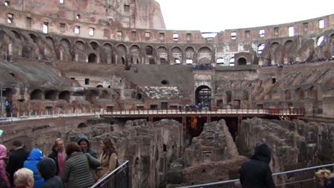 Tourists-inside-of-the-Colosseum,-Rome,-Italy