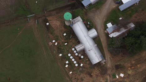 Top-Down-Aerial-View-of-agricultural-production-in-a-rural-area-and-agricultural-silo,-View-From-Above-of-Farm-in-Rome,-Bradford-County,-Pennsylvania,-Countryside-Scenery,-Camera-Rotates