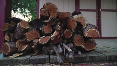 A-stack-of-firewood-mixed-with-mesquite,-oak,-and-maple-wood