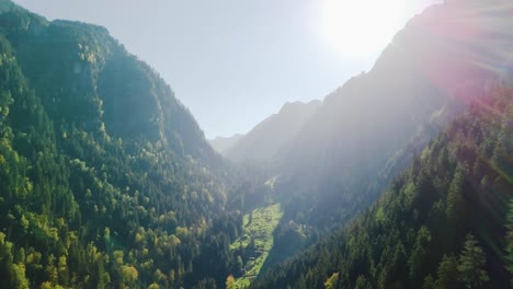 Backwards-flight-in-a-very-green-valley-in-Murg,-Switzerland