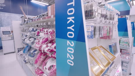 Female-Customer-In-Facemask-Looking-Around-Inside-The-Tokyo-2020-Olympic-Store-During-The-Pandemic-In-Japan