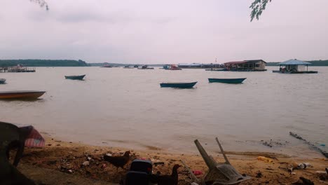 Docked-Boats-and-Floating-Village-Houses-in-Tanjung-Buai,-Johor,-Malaysia