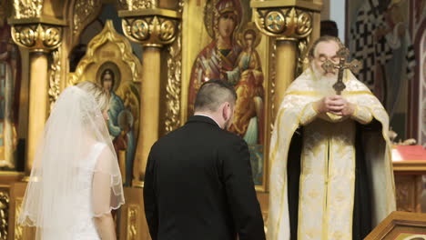 Orthodox-priest-blessing-a-couple-during-a-wedding