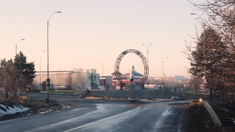 Traffic-roundabout-with-an-military-airplane-in-middle-available-for-people-to-watch