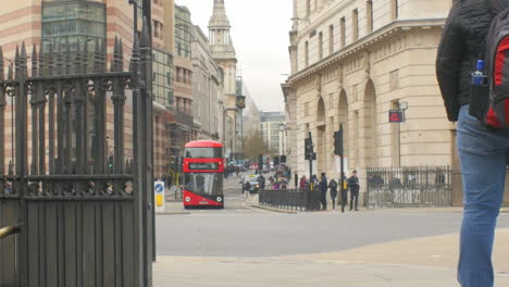 Red-double-decker-bus-in-the-financial-district-of-London