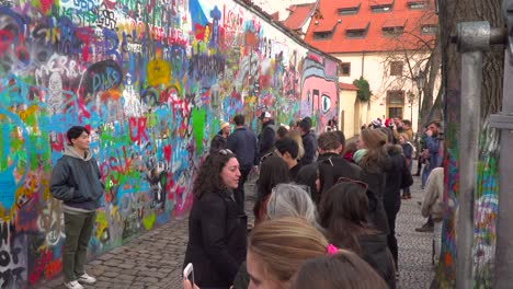 Crowd-of-people-taking-pictures-at-John-Lennon-Wall-in-Prague