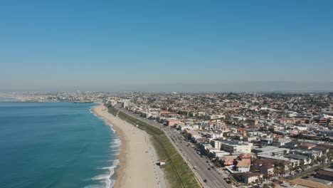 Afternoon-camera-drone-view-from-the-coast-and-buildings-of-Redondo-Beach,-California