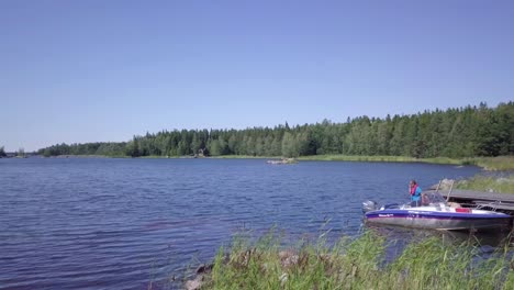 Busy-man-talking-business-on-a-cell-phone-while-driving-a-boat