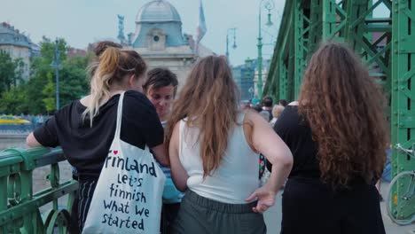 youngsters-gathered-standing-in-a-circle-checking-on-their-phones