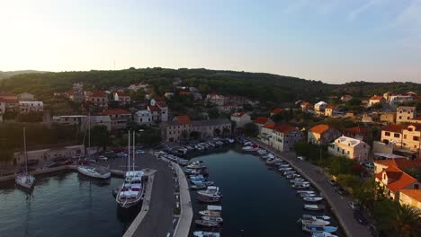 Aerial-drone-shot-of-the-marina-from-the-sea-to-the-land-in-Selca-Island-Brac-Croatia-Europe-circa-June-2016