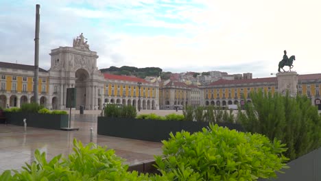 Slow-motion-push-in-to-Praca-de-Comercio-square-in-front-of-green-plants