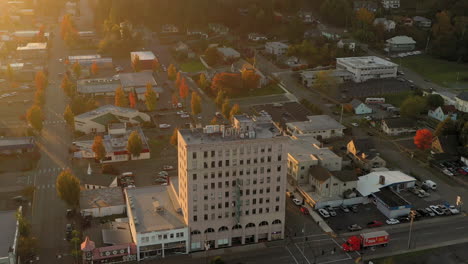 Old-building-in-Coos-Bay-Oregon-and-cars-on-Highway-101,-static-drone-shot