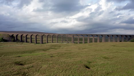 Aerial-Shot-Flying-Forwards-Through-Ribblehead-Viaduct-in-the-Yorkshire-Dales-National-Park