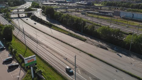 Aerial-view-showing-traffic-on-the-normally-heavy-trafficed-road-Alingsasleden-E20-leading-from-Gothenburg-to-Orebro-in-Sweden