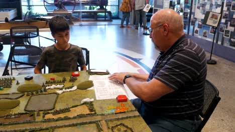 Adults-teach-young-people-how-to-play-tactical-civil-war-gaming