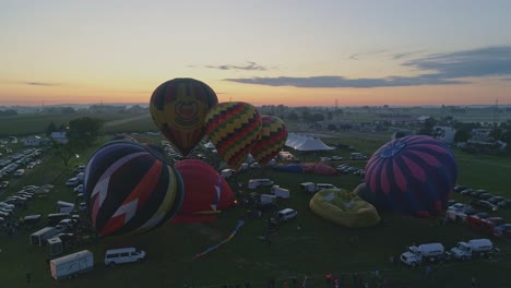 Aerial-View-of-Hot-Air-Balloons-Filling-Up-and-Taking-Off-at-a-Hot-Air-Balloon-Festival-on-a-Summer-Morning