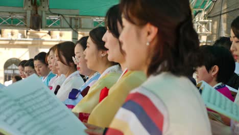 korean-people-with-hanbok-doing-orchestra-on-stage-during-korean-festival