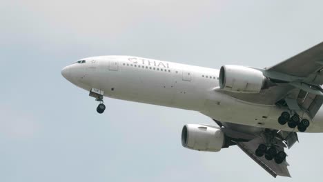 Thai-Airways-Boeing-777-2D7-HS-TJA-approaching-before-landing-to-Suvarnabhumi-airport-in-Bangkok-at-Thailand