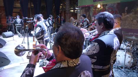 Over-the-head-shot-of-Mariachi-band-outdoors-at-night-in-Merida,-Yucatan,-Mexico