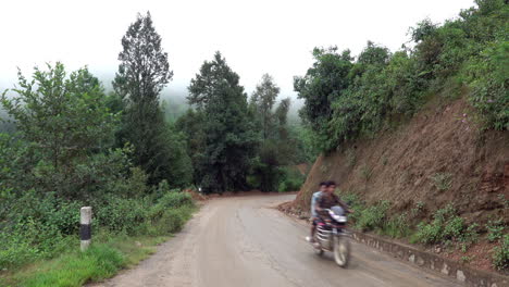 Kathmandu,-Nepal---September-27,-2019:-Traffic-and-vehicles-on-a-dangerous,-muddy-mountain-road-in-the-foothills-of-Kathmandu,-Nepal-on-September-27,-2019