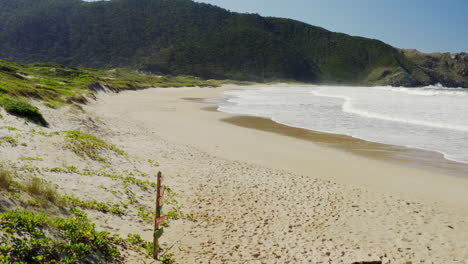 Establishing-shot-of-Lagoinha-Do-Leste-beach-sign,-Florianopolis,-Santa-Catarina,-Brasil