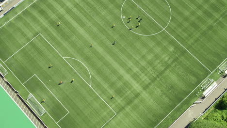 Topdown-aerial-shot-of-Maidstone-FC,-players-practicing-on-the-pitch