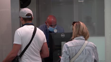 People-shave-their-passports-checked-at-the-Euro-Star-in-Kings-Cross-St-Pancras-station,-London,-UK