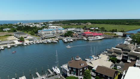 AERIAL-SLOW-MOTION-Lewes-Canal,-Delaware-With-Cruise-Ships-Moored