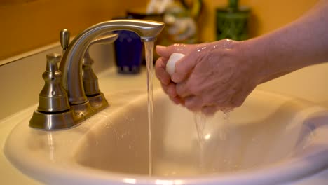 Mature-woman-uses-proper-hand-washing-to-avoid-the-flu-and-Coronavirus
