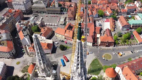Zagreb-Cathedral-North-Tower,-damaged-in-Earthquake,-preparing-for-controlled-demolition-by-alpinists---Aerial-Drone-View