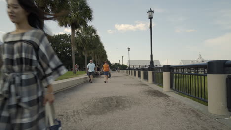 Asian-Couple-Walks-at-Waterfront-Park-In-Charleston,-South-Carolina