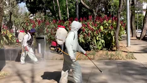 Life-in-Mexico-City,-government-staff-sanitizing-a-park-in-Mexico-City,-park-where-covid-tests-are-performed