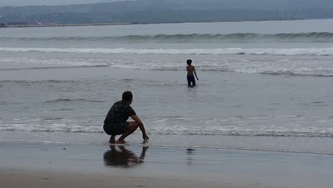 Visitor-activities-at-double-six-beach-in-the-late-afternoon,-Bali,-November-25,-2020