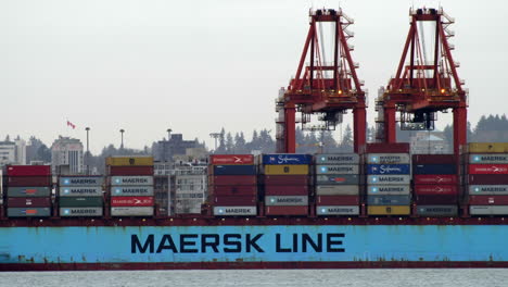 Gantry-Crane-At-Work-In-Port-Of-Vancouver-In-Canada---Lifting-And-Loading-Container-To-Maersk-Line-Cargo-Ship---static-shot