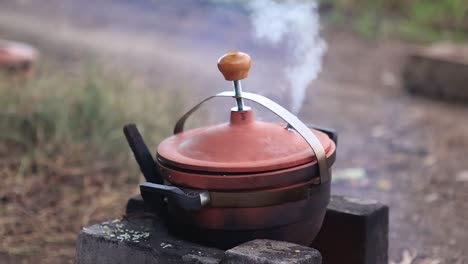 Clay-Cooker-burning---Whistling,-Cooking-Equipment-Stock-Footage,-Kitchen-Stock-Footage,-Clay-Product-Stock-Footage