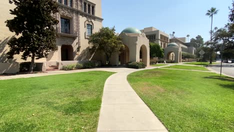 Walking-towards-California-Institute-of-Technology,-on-a-sunny-day,-in-Pasadena,-Los-Angeles,-USA---POV-shot