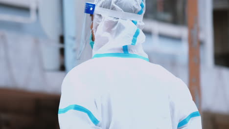 Close-up-asian-doctor-in-personal-protective-suit-or-PPE-with-mask