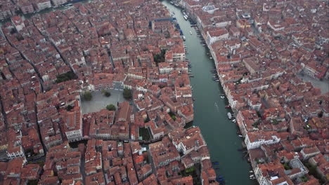 Wide-aerial-shot-of-Canal-Grande-and-Campo-San-Polo-at-dusk,-Venice,-Italy